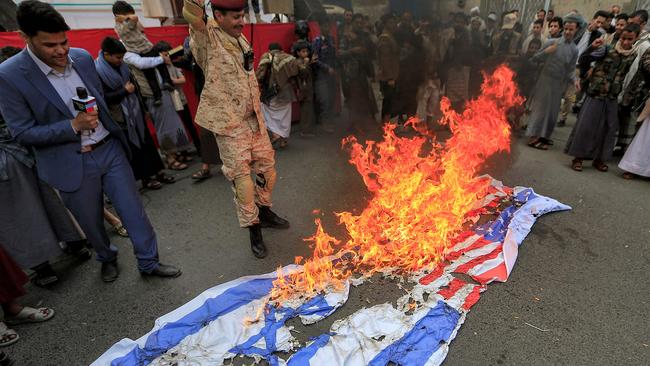 Yemenis set ablaze Israeli and US flags during a demonstration in the Huthi-held capital Sanaa earlier this month.