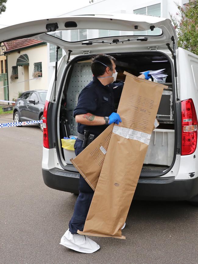 Police outside the Annandale home on Monday. Picture: Richard Dobson