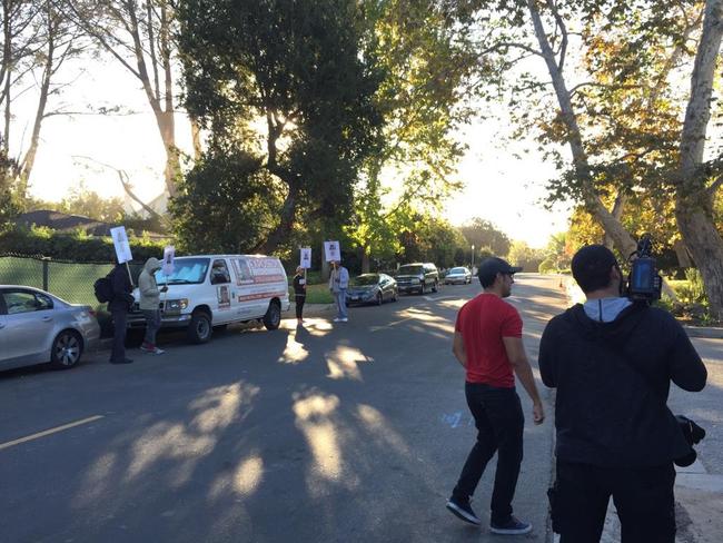 Protesters paid by the Kazals to protest outside the Los Angeles home and business of Rodric David.