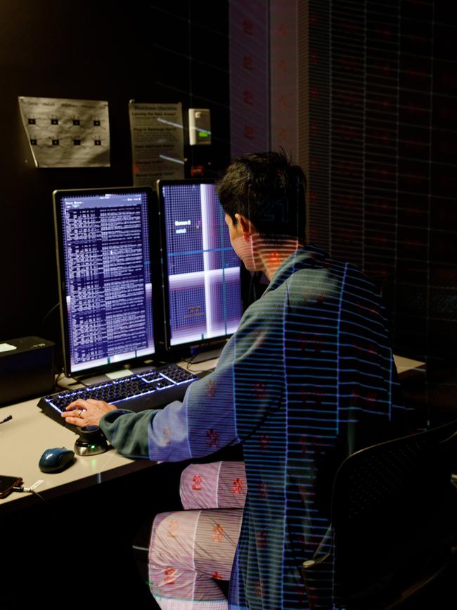 Darren Lee, developer for the UTS Data Arena, setting the space up at a computer terminal. Picture: Max Mason-Hubers