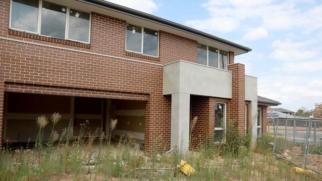 A house left abandoned on the corner of Armoury and Navy Rd, Jordan Springs. Armoury Rd was closed to traffic over the New Year period, and reopened in late January. Picture: AAP Image/Angelo Velardo.