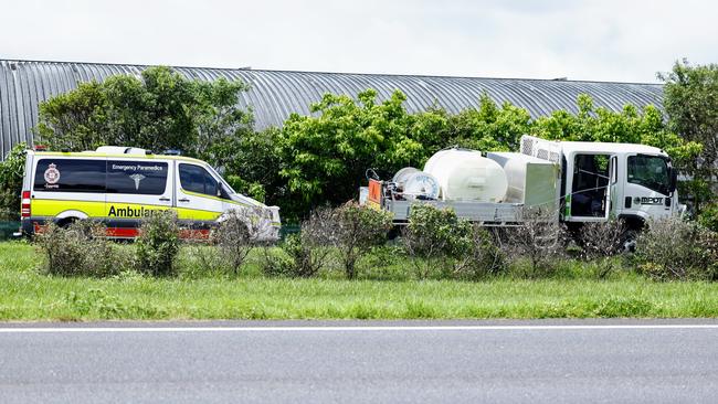 Emergency Services personnel attend the scene of a collision between an SUV and a road maintenance unit spraying for weeds on the median nature strip along Ray Jones Drive in Portsmith. Picture: Brendan Radke