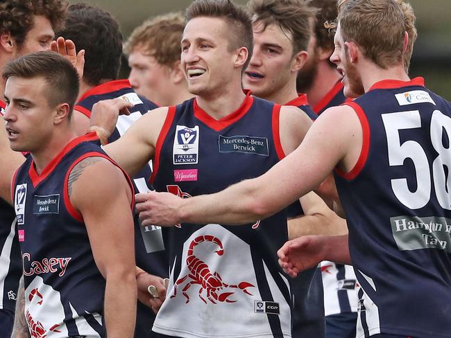 MELBOURNE, VICTORIA - SEPTEMBER 03: Jack Grimes of Casey Scorpions is congratulated by his teammates after kicking a goal during the VFL Qualifying Final match between Casey and Footscray at Casey Fields on September 3, 2016 in Melbourne, Australia. (Photo by Scott Barbour/AFL Media/Getty Images)