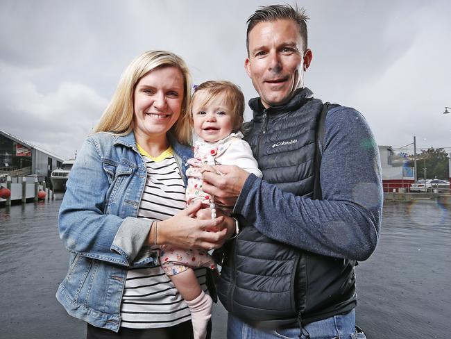 English tourists Paula and Jordan Williams with 1-year-old daughter Grace enjoy Hobart. Picture: ZAK SIMMONDS