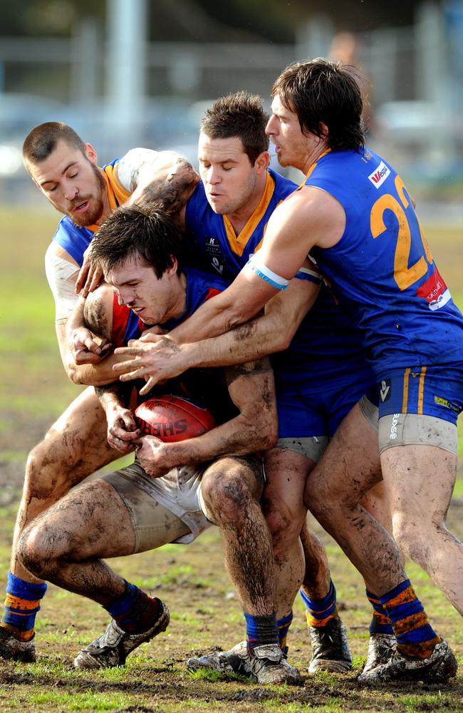 Mitch Woods battling it out for Port Melbourne against Williamstown.