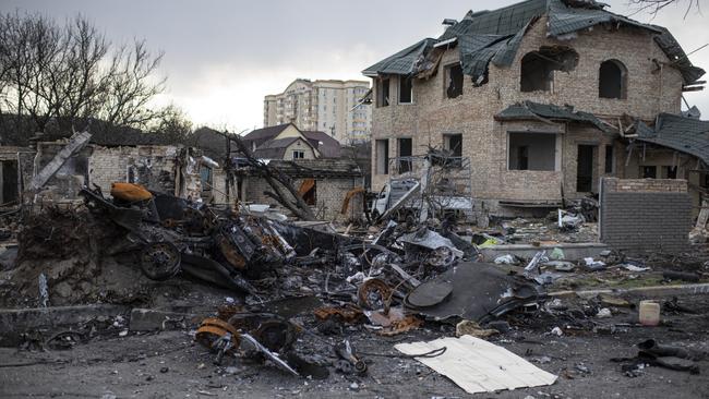 Destroyed Russian military vehicles on a street in Bucha on Monday. Picture: Getty Images