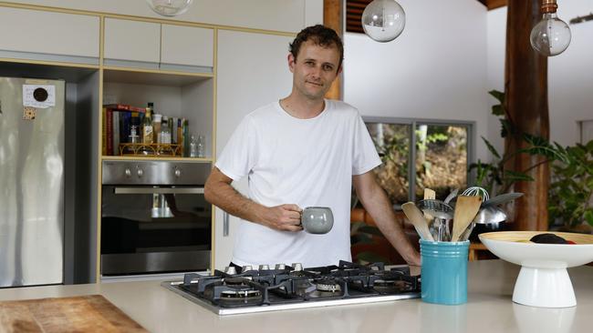 With the Reserve Bank continuing to raise interest rates, new homeowners such as Toby Phillips are having to watch their household budgets. He and his wife bought their Smithfield home two months ago, with minimum repayments increasing by $210 a week in that time. Picture: Brendan Radke