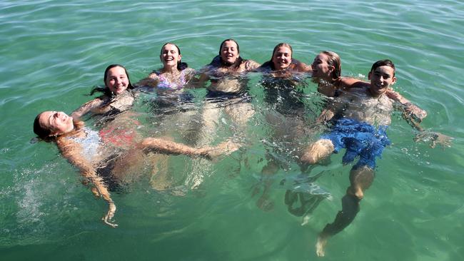 Friends Ava, Evie, Charli,, Jazz, Myah,, Olivia and Elijah at Henley Beach enjoying the warm weather. Picture: NCA NewsWire / Kelly Barnes