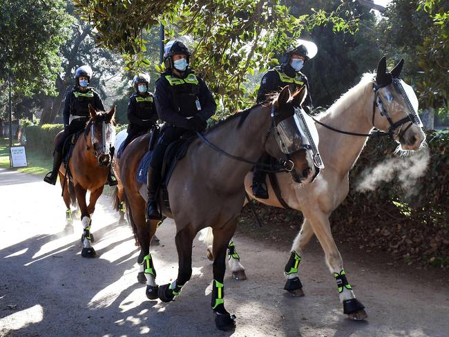 Police wearing face masks at The Shrine of Remembrance this week. Picture: AFP