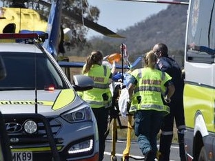 A victim is taken to hospital after the crash. Picture: Bev Lace