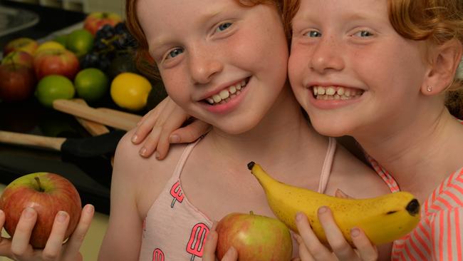 Twins Sophie and Milla Hannay, 8, are into healthy eating. A government review recommends removing snacks high in fat and sugar from sports grounds and schools. Picture: Evan Morgan