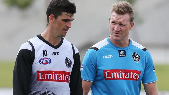 Scott Pendlebury and coach Nathan Buckley at Magpies training on Monday morning. De Goey didn’t train with his teammates. Picture: David Crosling