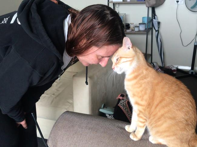 Bec and Jonty the cat. An increasing number of animals are finding a new life outside of research as pets and valued members of families.