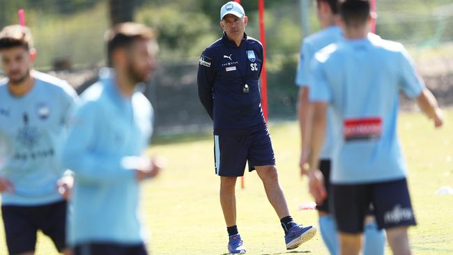 Sydney FC coach Steve Corica watches his players training for tomorrow’s grand final against Perth Glory. Picture: Phil Hillyard