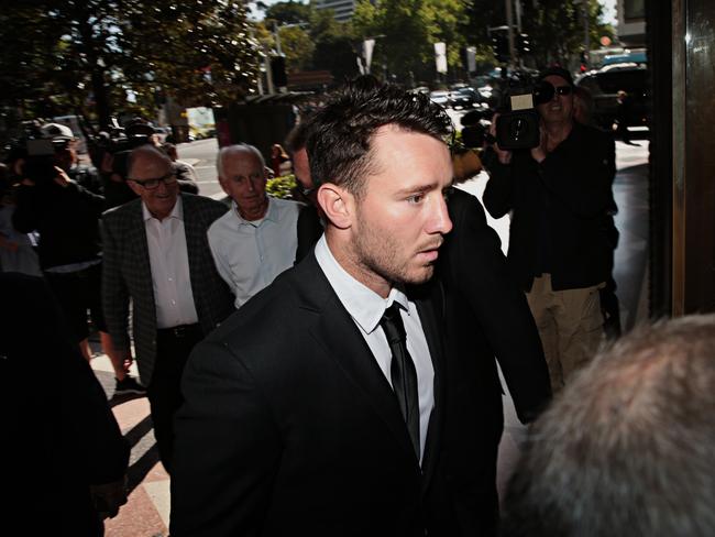 Liam Coleman (black suit and black tie), now a labourer, arrives at court this morning. Picture Adam Yip