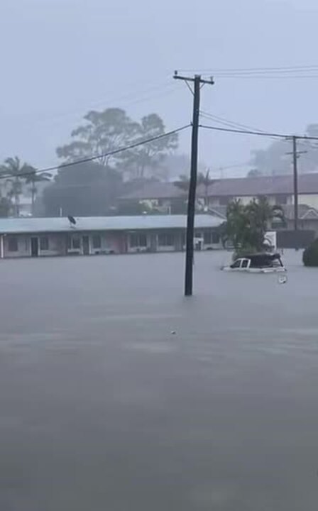 Ute driven in floodwaters up to windows