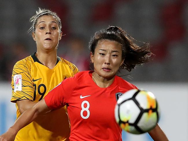 AMMAN, JORDAN - APRIL 07: Katrina Gorry of Australia and Cho So Hyun of Korea Republic in action during the AFC Women's Asian Cup Group B match between Australia and South Korea at the King Abdullah II Stadium on April 7, 2018 in Amman, Jordan.  (Photo by Francois Nel/Getty Images)