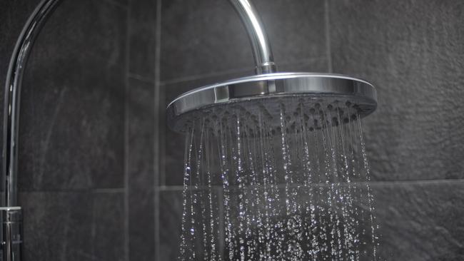 Large shower head spraying water.