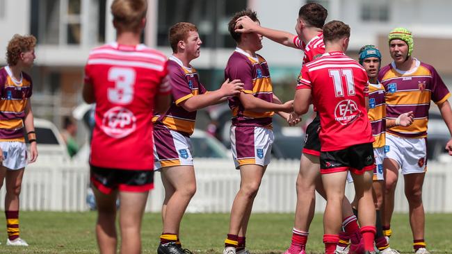 Kane Crowe gets a head rub from the opposition after knocking-on. Picture: Adam Wrightson Photography