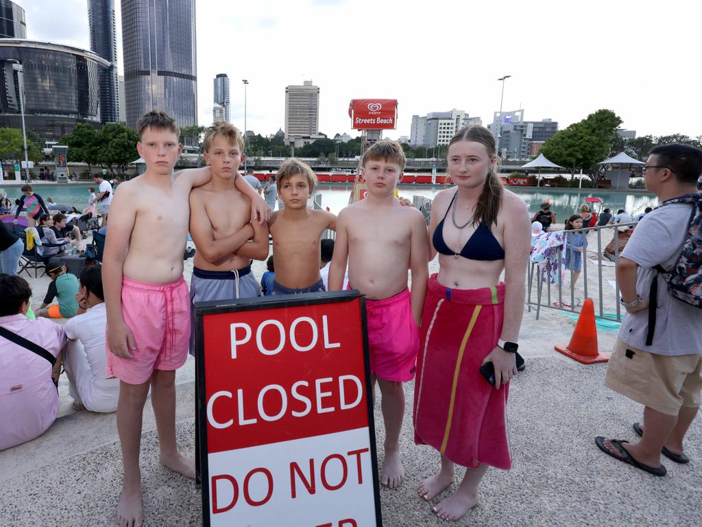 Fletcher Fenwick, 12, Mason Suckling, 11, Phoenix Roberts, 11, Dario Jackson, 13, Danica Jackson, 17, were locked out of Streets Beach at South Bank. Picture: Steve Pohlner