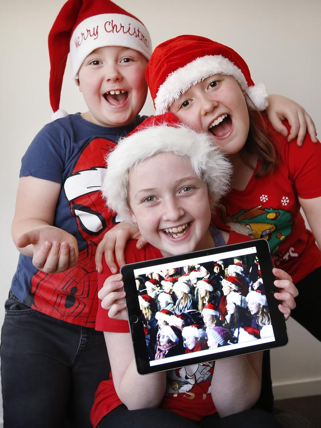 Melbourne councils are preparing to livestream their carols to viewers like siblings Tyler, 6, Tahlia, 13 and Keira, 11, with no one sure what COVID restrictions will be in place by December. Picture: David Caird