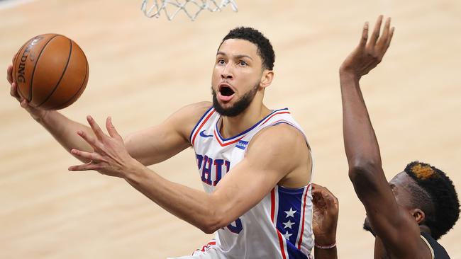 ATLANTA, GEORGIA - JUNE 14: Ben Simmons #25 of the Philadelphia 76ers drives against Clint Capela #15 of the Atlanta Hawks during the first half of game 4 of the Eastern Conference Semifinals at State Farm Arena on June 14, 2021 in Atlanta, Georgia. NOTE TO USER: User expressly acknowledges and agrees that, by downloading and or using this photograph, User is consenting to the terms and conditions of the Getty Images License Agreement. (Photo by Kevin C. Cox/Getty Images)