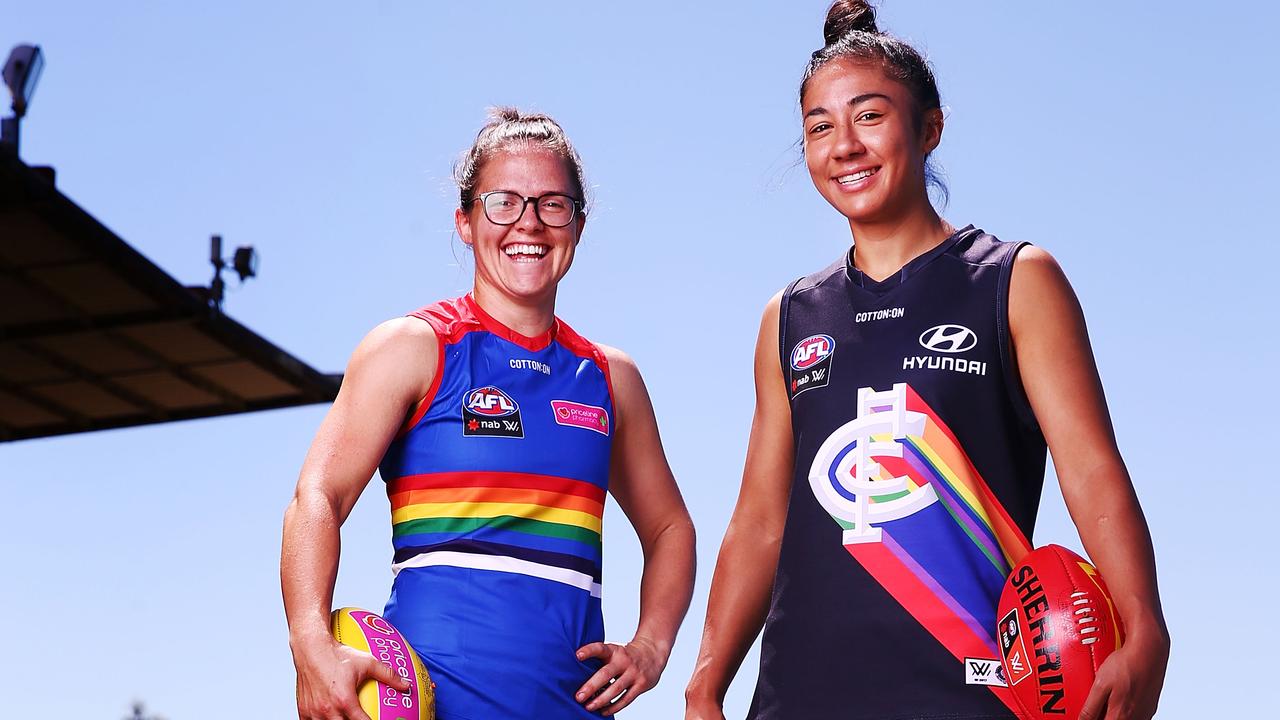 Darcy Vescio and then Bulldog Emma Kearney model jumpers for last year’s Pride Game. Picture: Getty Images 