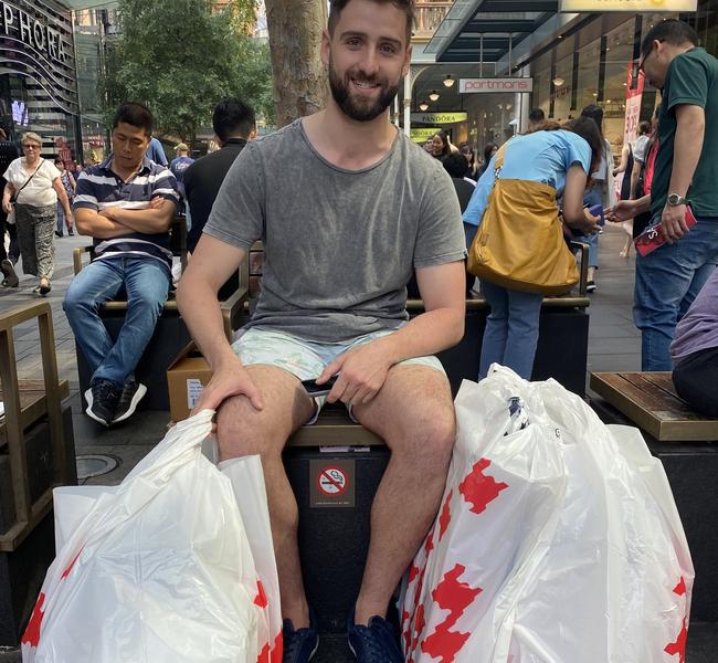 Aaron Wilkinson waiting for his family to finish shopping. Picture: Rachel Lang