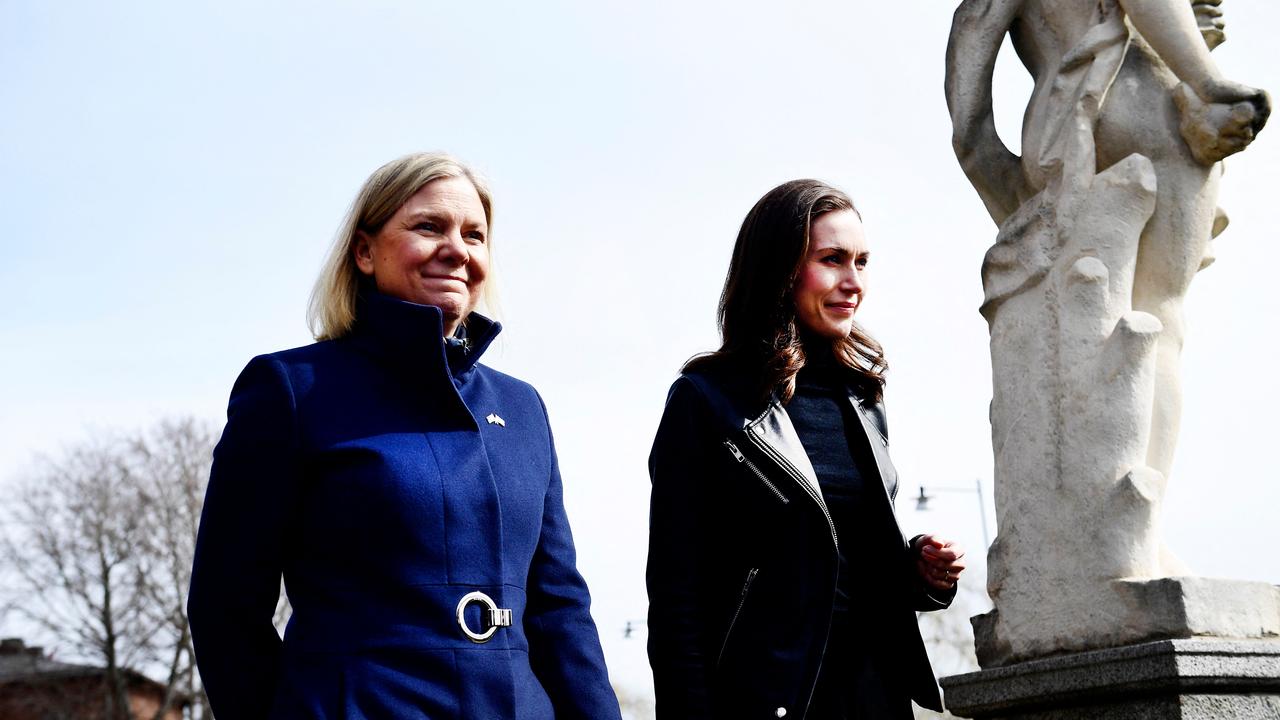 Swedish Prime Minister Magdalena Andersson (L) welcomes Finnish Prime Minister Sanna Marin. (Photo by Paul WENNERHOLM / TT News Agency / AFP) / Sweden OUT