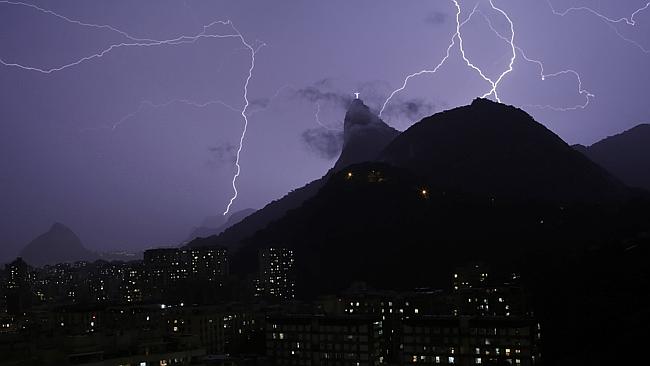 Violent ... Lightning and rain across Rio de Janeiro flooded streets and knocked out power in some neighbourhoods. Picture: AP