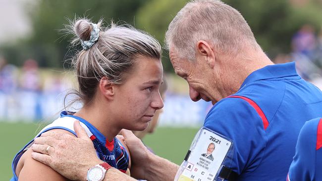 A shattered Deanna Berry is comforted by Nathan Burke.