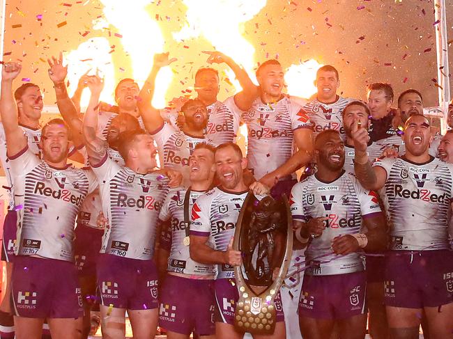 SYDNEY, AUSTRALIA - OCTOBER 25: Cameron Smith of the Storm holds aloft the Premiership trophy and celebrates with team mates after winning the 2020 NRL Grand Final match between the Penrith Panthers and the Melbourne Storm at ANZ Stadium on October 25, 2020 in Sydney, Australia. (Photo by Cameron Spencer/Getty Images)