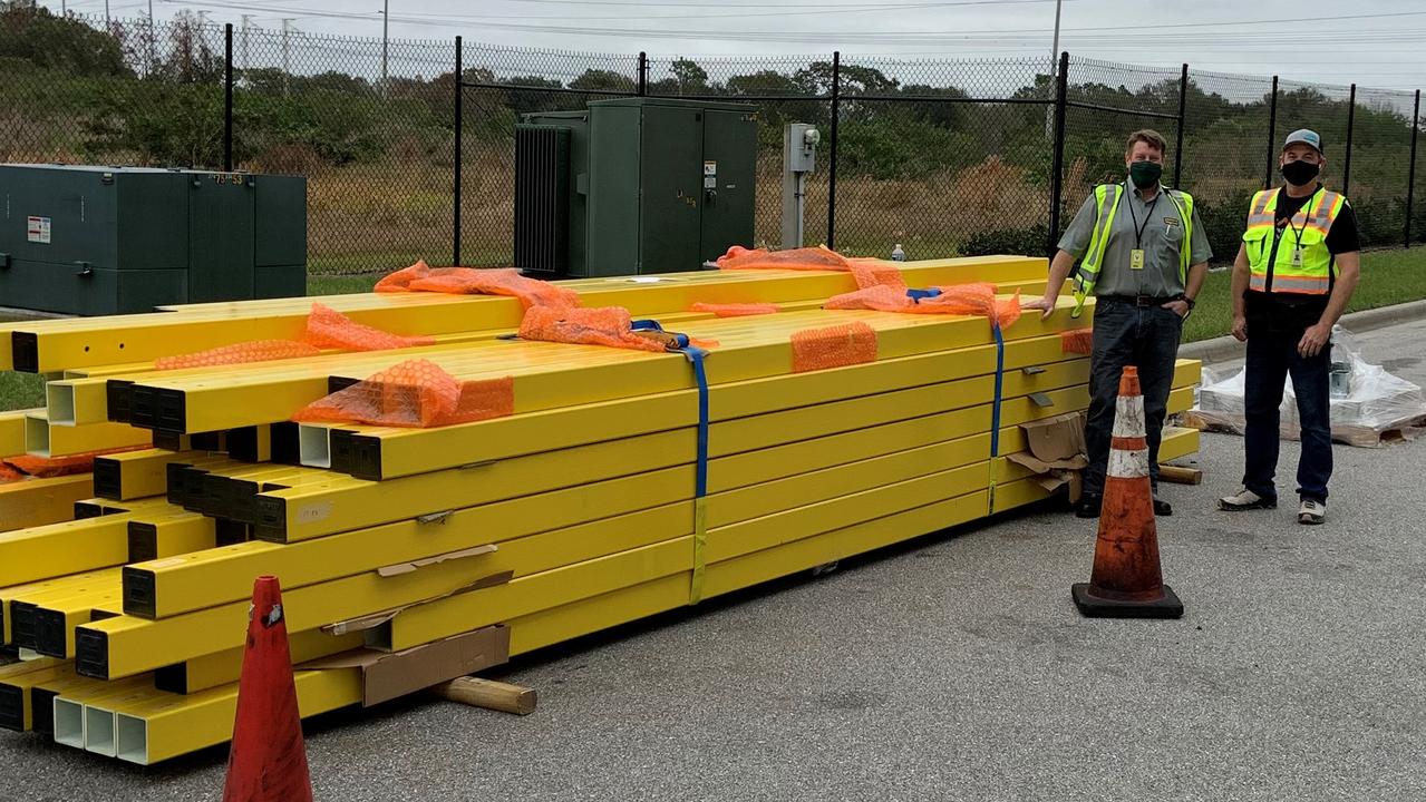 EXPANSION PLANS: Preparing to ship off Wagners composite fibre frameworks to be used in new sound mitigation systems at Amazon distribution centres are (from left) Wagners USA employee Dennis Higgins and Behrens and Associates’ Geordie Richardson. The Toowoomba company plans to open its new American plant by September.