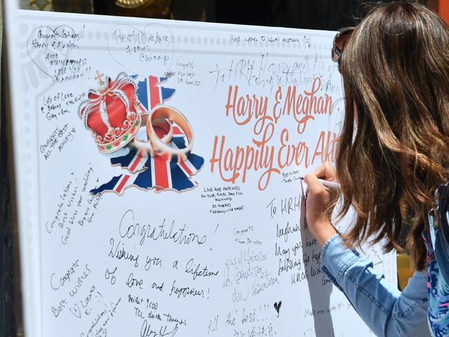 The card is available to sign all week until the May 19 wedding in England, which will be shown on the cinema’s big screen. Picture: AFP Photo / Frederic J. Brown