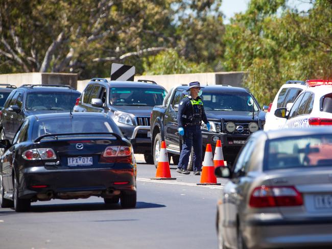 Victoria Police man a checkpoint on the Echuca-Moama bridge, the border between Victoria and NSW. Picture: Mark Stewart