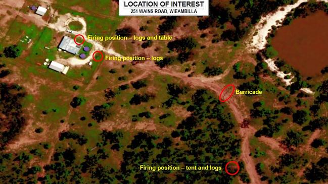 An aerial image of the Wains Rd property showing the firing positions of the Trains, along with one of the sniper hides and the makeshift barricade to hinder approaching vehicles. Picture: Supplied / Queensland Police