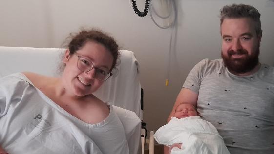Imogen, her partner Michael and her beautiful first child Beau.