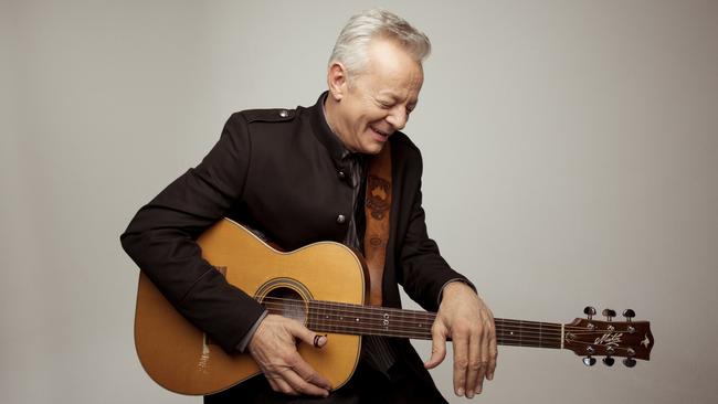 Tommy Emmanuel with a favourite Maton acoustic guitar, in Nashville in 2019. Picture: Alysse Gafkjen