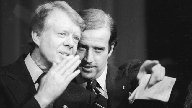 Mr Biden with president Jimmy Carter during a fundraiser.