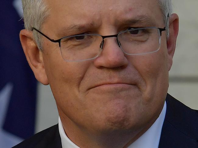 CANBERRA, AUSTRALIA - DECEMBER 11: Prime Minister Scott Morrison reacts during a press conference in the Prime Ministers courtyard on December 11, 2020 in Canberra, Australia. Clinical trials of a COVID-19 vaccine being developed by the University of Queensland in partnership with biotech company CSL will be abandoned, after the Federal Government had committed to purchasing, and agreements had been made to secure 51 million doses of the vaccine. (Photo by Sam Mooy/Getty Images)