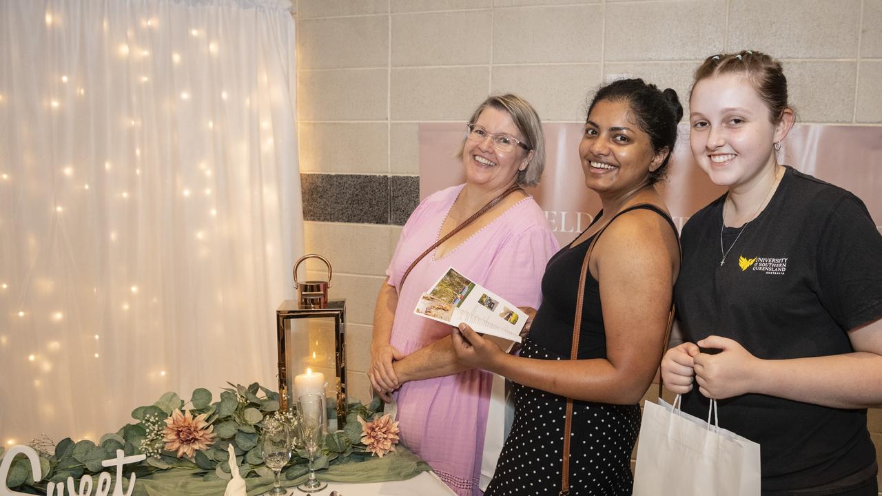 Bride-to-be Sharon Oommen (centre) with Jodie (left) and Lilly Hayes check out the Highfields Cultural Centre display at Toowoomba's Wedding Expo hosted by Highfields Cultural Centre, Sunday, January 21, 2024. Picture: Kevin Farmer