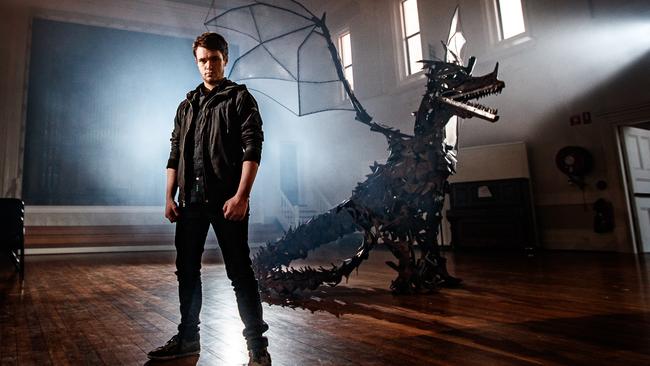 Artist Liam Davies-Brown with his giant metal dragon sculpture at the Barossa Regional Gallery as part of the SALA Festival. Picture: Matt Turner.