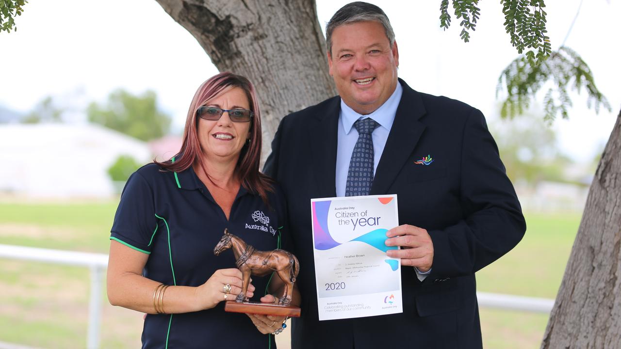 Going above and beyond to help her community earned Heather Brown, pictured with Whitsunday Mayor Cr Andrew Willcox, a prestigious award last year. This year, it has landed her in court. File photo