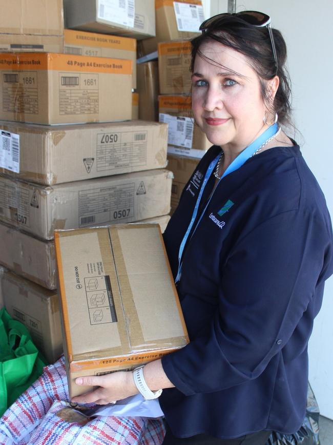 Family Relationships Centre Mackay manager Louisa Loots helps sort out stock at the Mackay PCYC on Wednesday, January 4, 2023. Picture: Andrew Kacimaiwai