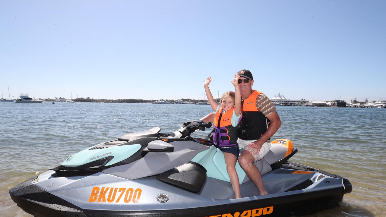 Huge crowds for the first day of the Gold Coast Show. Arriving to the show by Jetski were Simon Delzoppo and his daughter Arabella, 6. Picture: Glenn Hampson