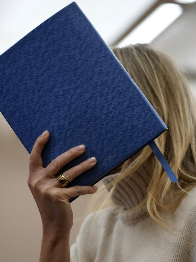 Paltrow shielded her face with a blue notebook as she exited the courtroom. Picture: Rick Bowmer-Pool/Getty Images