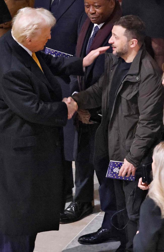 US President-elect Donald Trump shakes hands with Ukraine's President Volodymyr Zelensky inside Notre-Dame Cathedral. Trump and Zelensky have discussed a potential ‘deal’ to end the war with Russia, with Trump advocating for an immediate ceasefire and negotiations. Picture: AFP