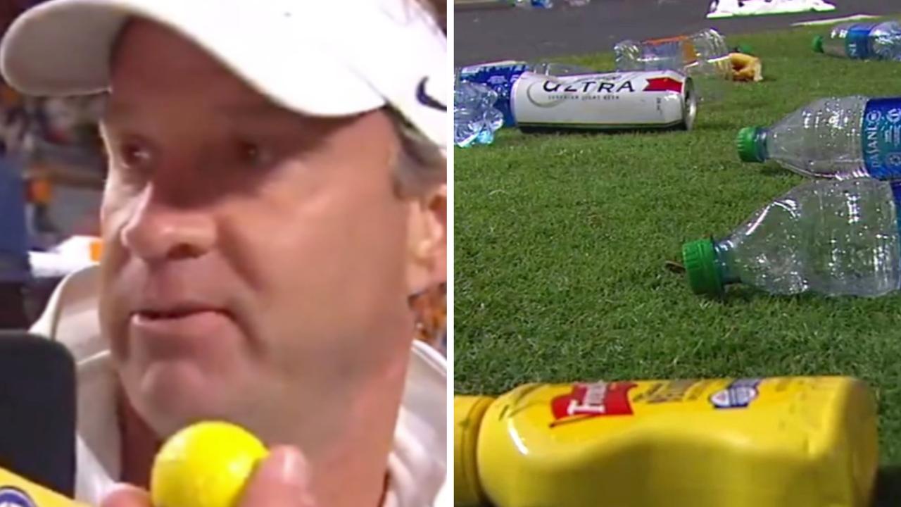 The opposing coach was hit with a golf ball and the field covered in rubbish as Tennessee fans raged over a late call in their college football game against Ole Miss.