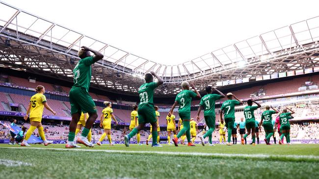 Australia and Zambia walk out in front of empty stands. (Photo by Marc Atkins/Getty Images)