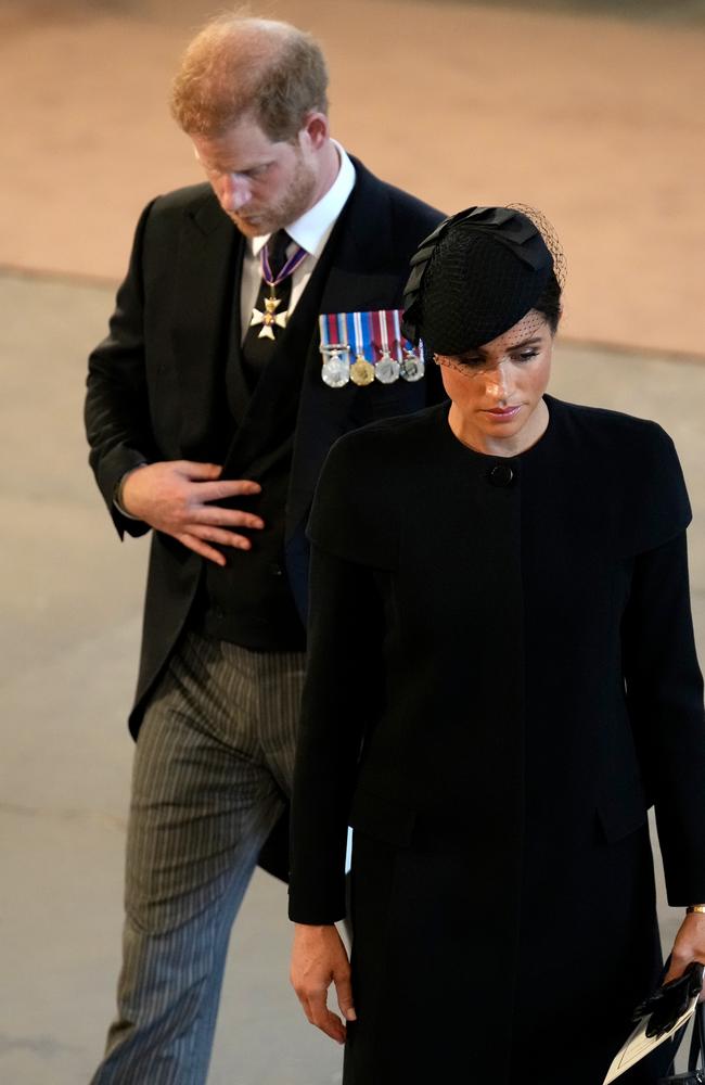 Prince Harry, Duke of Sussex and Meghan, Duchess of Sussex pay their respects at The Palace of Westminster during the procession for the Lying-in State of Queen Elizabeth II. Picture: Getty